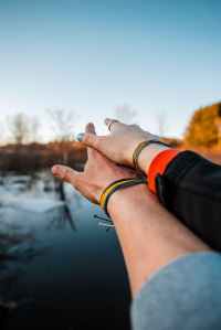 woman s right hand on top of man s right hand